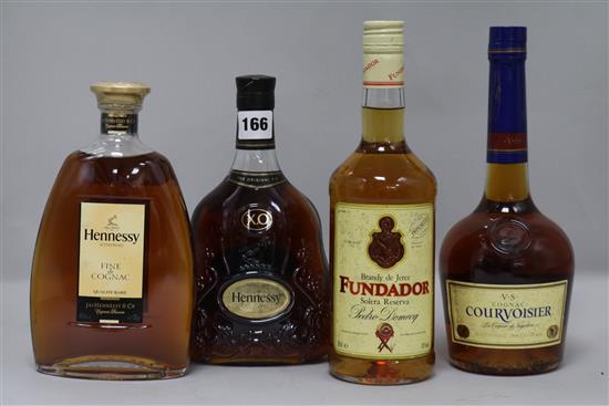 A bottle of Hennessy XO, two cognacs and one Spanish brandy